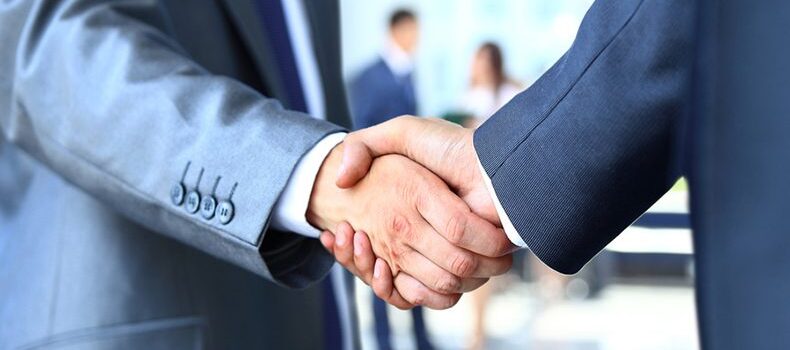 Two businessman shaking hands